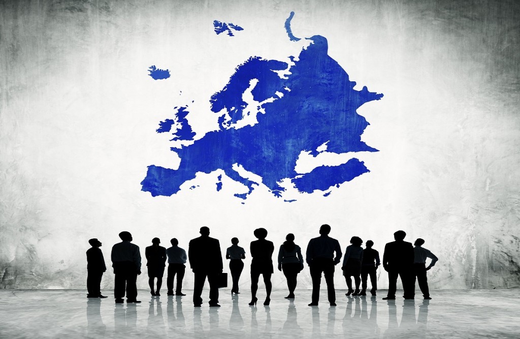 Group Of Business People Standing In A White Background With Blue Europe Cartography Above
